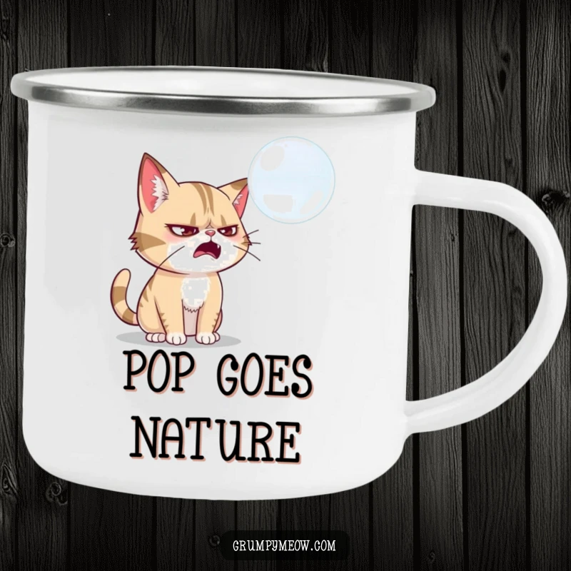 Funny grumpy cat camping mug, swatting at a soap bubble, embodying outdoor fun, a wonderful funny gift for campers.