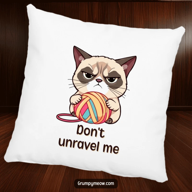 Funny plush pillow featuring a grumpy cat with narrowed eyes, judging yarn with a critical stare, a soft funny gift.
