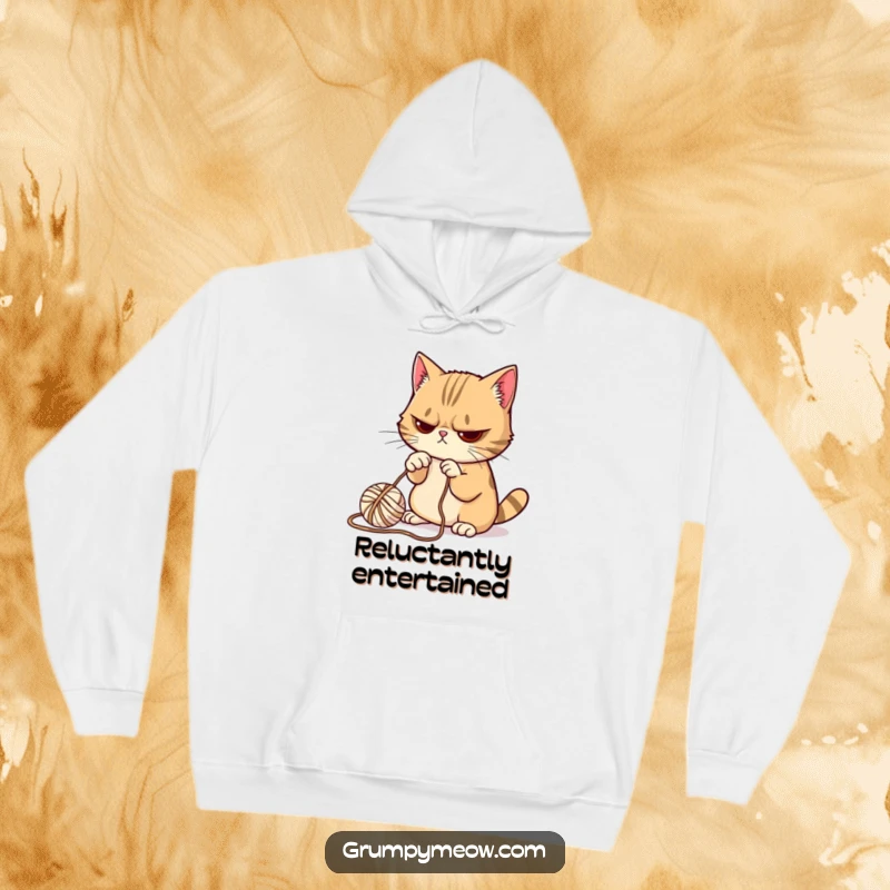 Funny Grumpy Cat Hoodie: Soft and warm, depicting a grumpy cat reluctantly batting at a ball of yarn.