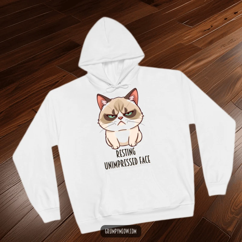 Funny Grumpy Cat Hoodie: A grumpy cat slowly blinks, offering cozy warmth and unimpressed feline charm.