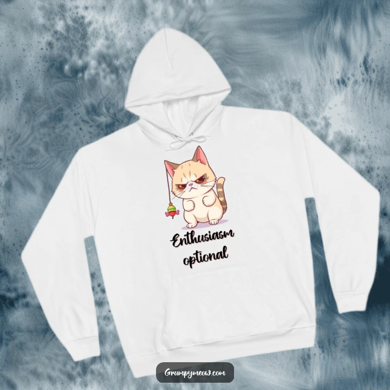 Funny hoodie featuring a grumpy cat batting a toy with visible disdain, conveying humorous unimpressed feline entertainment.