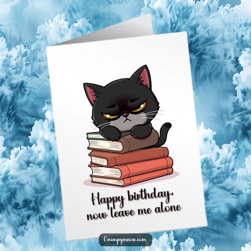 Funny Free Printable Birthday Card: A black cat with a permanent scowl attempts to nap on a stack of dangerously leaning books.