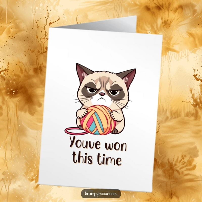 Funny Free Printable Congrats Card: Grumpy cat narrowed eyes, judging a brightly colored ball of yarn.
