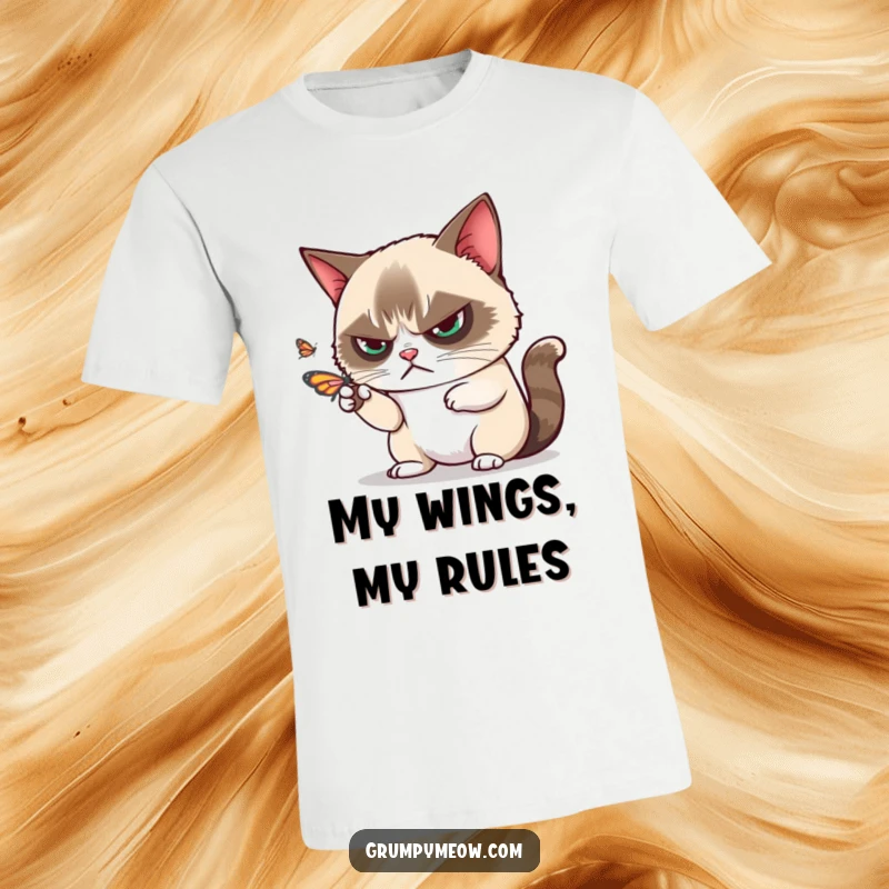 Funny grumpy cat disdainfully batting away a playful butterfly with one paw on a t-shirt, a classic funny gift.