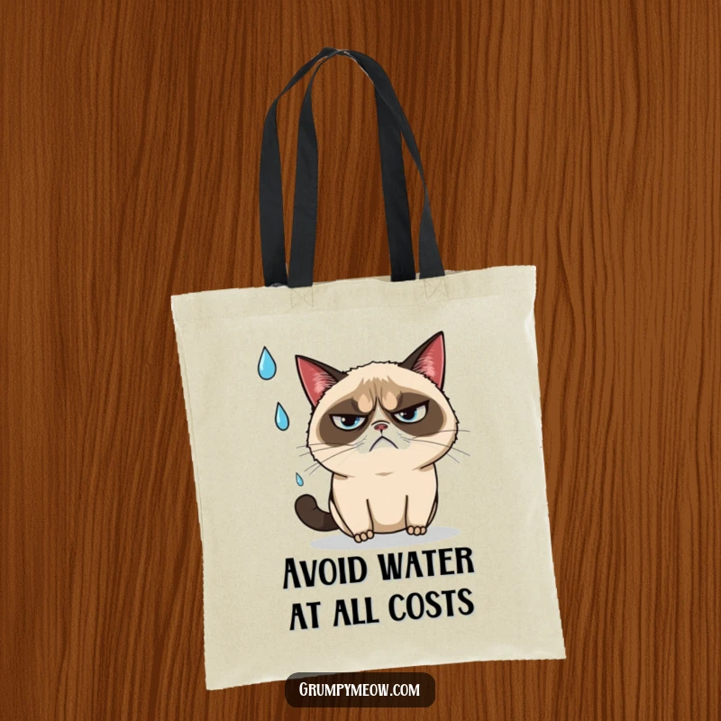 Funny grumpy cat narrowly dodging a falling raindrop with an annoyed sigh on a tote bag, a stylish funny gift.