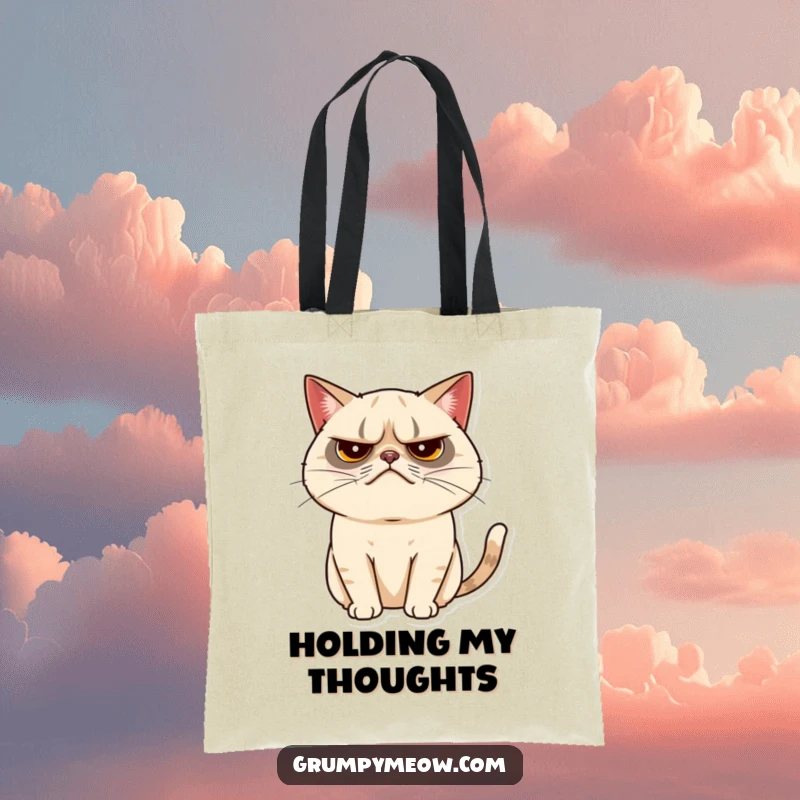 Funny grumpy cat tote bag illustrating a cat with a tiny, almost imperceptible tail twitch, a discreet expression of mood.