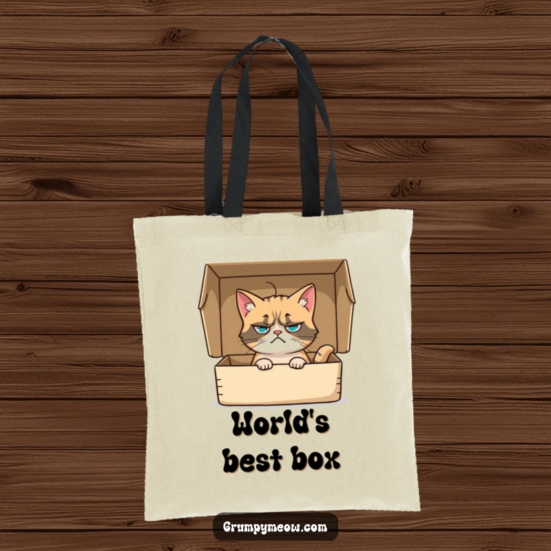 Funny tote bag with a grumpy cat sitting inside a box, its whisker twitching with a hint of judgment, a humorous accessory.